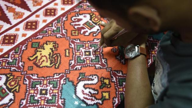 Now even though there is demand for the fabric, there aren’t enough weavers left, says Rohit’s nephew Rahul, a weaver and trained architect. He is the one who has designed Patola House. It’s time consuming work, and it is labour intensive. Multiple rounds of tie and dye are done before the weaving begins. (Sanchit Khanna / HT Photo)