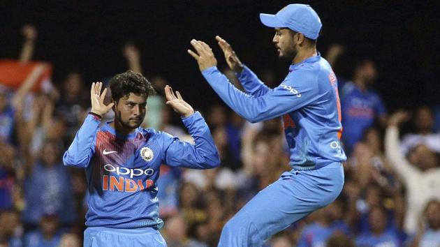 India's Kuldeep Yadav, left, celebrates with Manish Pandey after the dismissal of Australia's Chris Lynn.(AP)