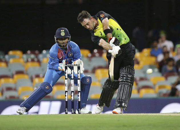 Australia's Glen Maxwell, right, plays a shot as Indian wicketkeeper Rishabh Pant, left, looks on during the first T20 International cricket match between Australia and India in Brisbane. (AP)