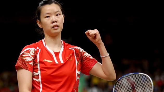 Xuerui Li of China celebrates a point win over Porntip Buranaprasertsuk of Thailand.