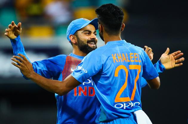 India's Virat Kohli (L) congratulates teammate Khaleel Ahmed on dismissing Australia's batsman D'Arcy Short during the T20 international cricket match between Australia and India in Brisbane. (AFP)