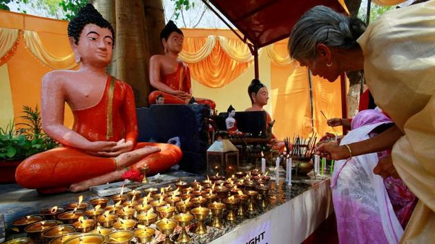 Devotees light candles at a Buddhist temple on the occasion of Buddha Purnima festival in Chandigarh.(Reuters file photo for representation)