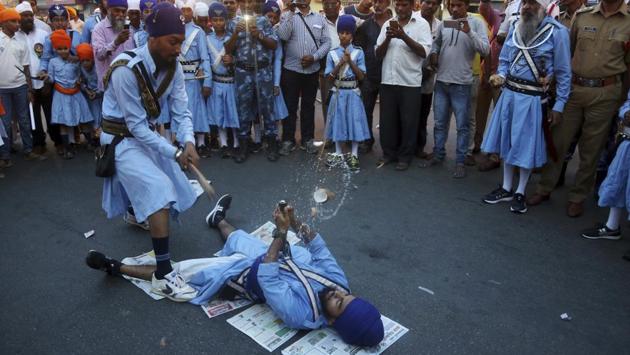 Sikhs display their martial art skills during a religious procession ahead of the birth anniversary of the first Sikh guru, Guru Nanak, in Hyderabad, Telangana on November 19, 2018. (Mahesh Kumar A / AP) Sikhs display their martial art skills during a religious procession ahead of the birth anniversary of the first Sikh guru, Guru Nanak, in Hyderabad, Telangana on November 19, 2018. (Mahesh Kumar A / AP)
