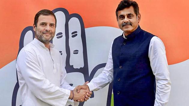 Congress President Rahul Gandhi shakes hands with Telangana MP K Vishweshwar Reddy who has resigned from the TRS, Medchal, Wednesday, Nov. 21, 2018.(PTI)