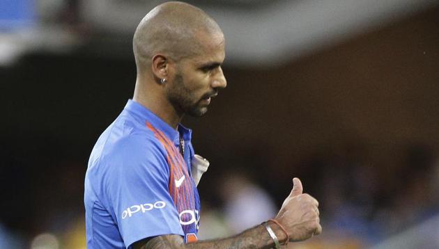 Shikhar Dhawan walks back to the pavilion after being dismissed on Wednesday.(AP)