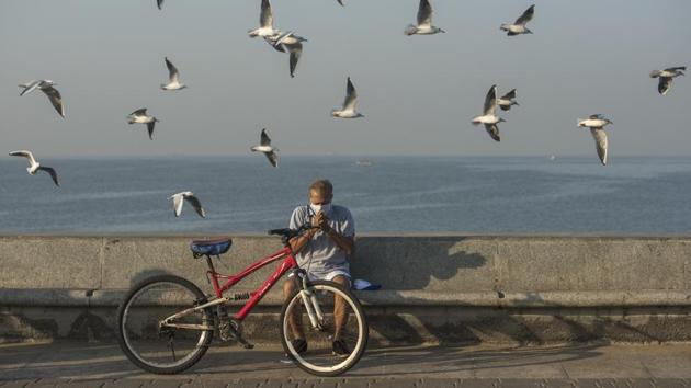 A man performs morning exercise as a flock of Seagulls fly over him at Marine Drive in Mumbai, Maharashtra on November 17, 2018. (Pratik Chorge / HT Photo) A man performs morning exercise as a flock of Seagulls fly over him at Marine Drive in Mumbai, Maharashtra on November 17, 2018. (Pratik Chorge / HT Photo)
