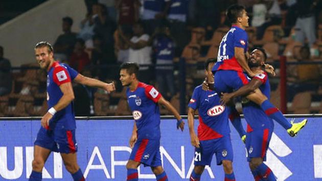 Bengaluru FC captain Sunil Chhetri, second right, celebrates with teammates after scoring a goal.(AP)