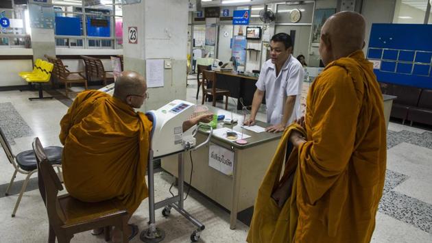 “According to Lord Buddha’s teaching, whatever they offer, we have to accept. We can’t deny, we can’t reject,” said Phra Rajvoramuni, the assistant abbot at Sungvej temple in Bangkok who helped author the new charter. Rajvoramuni hopes that health education -- including training clergy to run basic medical check-ups -- will bring about change. (Romeo Gacad / AFP) “According to Lord Buddha’s teaching, whatever they offer, we have to accept. We can’t deny, we can’t reject,” said Phra Rajvoramuni, the assistant abbot at Sungvej temple in Bangkok who helped author the new charter. Rajvoramuni hopes that health education -- including training clergy to run basic medical check-ups -- will bring about change. (Romeo Gacad / AFP)