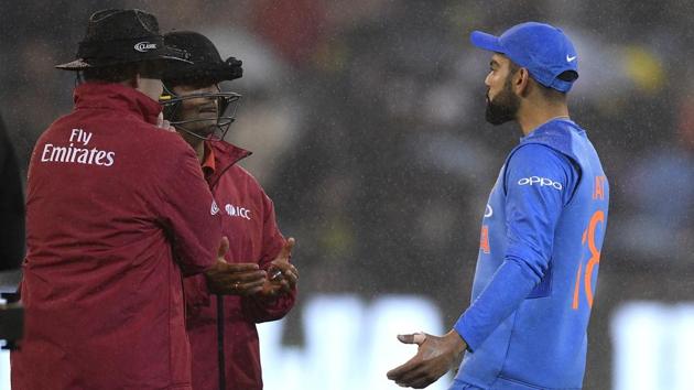 India's Virhat Kohli gestures as he talk with the umpires as rain falls during the Twenty20 international. (AP) India's Virhat Kohli gestures as he talk with the umpires as rain falls during the Twenty20 international. (AP)