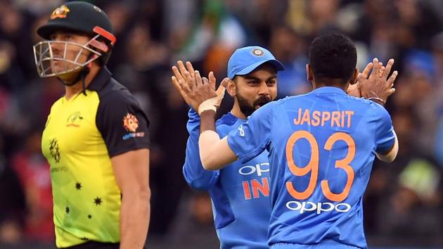 Jasprit Bumrah (R) is congratulated by captain Virat Kohli (C) after dismissing Australia's batsman Marcus Stoinis during their T20 international cricket match at the MCG in Melbourne. Rain played spoilsport as the match was abandoned. Not a single ball was bowled after Australia posted 132/7 in 19 overs. (William West / AFP) Jasprit Bumrah (R) is congratulated by captain Virat Kohli (C) after dismissing Australia's batsman Marcus Stoinis during their T20 international cricket match at the MCG in Melbourne. Rain played spoilsport as the match was abandoned. Not a single ball was bowled after Australia posted 132/7 in 19 overs. (William West / AFP)