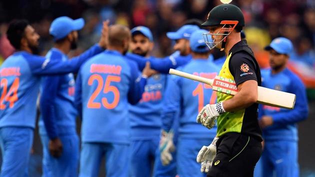 Australia's batsman Chris Lynn (R) walks off after been dismissed by India during their T20 international. (AFP) Australia's batsman Chris Lynn (R) walks off after been dismissed by India during their T20 international. (AFP)