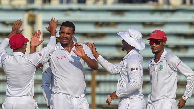 West Indies cricketer Shannon Gabriel (2nd L) celebrates with teammates after the dismissal of Bangladesh cricketer Mohammad Mahmudullah during the first day of the first Test cricket match between Bangladesh and the West Indies.(AFP)