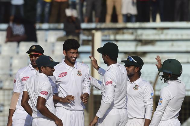 Bangladesh cricketers congratulate teammate Nayeem Hasan (3rd L) after the dismissal of the West Indies cricketer Jomel Warrican during the second day of the first Test cricket match between Bangladesh and West Indies.(AFP) Bangladesh cricketers congratulate teammate Nayeem Hasan (3rd L) after the dismissal of the West Indies cricketer Jomel Warrican during the second day of the first Test cricket match between Bangladesh and West Indies.(AFP)