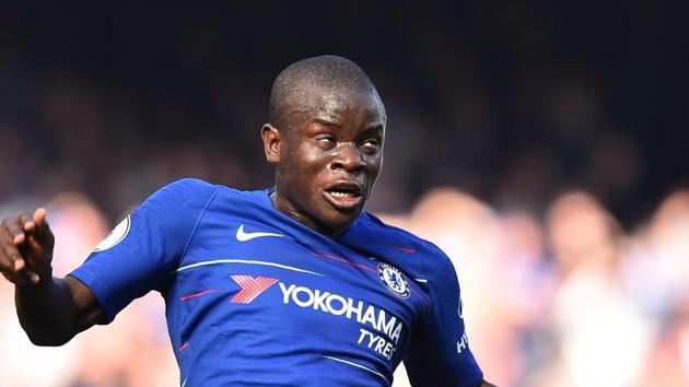 Chelsea's French midfielder N'Golo Kante heads the ball during the English Premier League football match.(AFP)