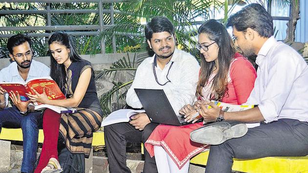 Students of Pumba, are seen preparing for various entrance exams on campus, on Tuesday.(RAVINDRA JOSHI/HT PHOTO) Students of Pumba, are seen preparing for various entrance exams on campus, on Tuesday.(RAVINDRA JOSHI/HT PHOTO)