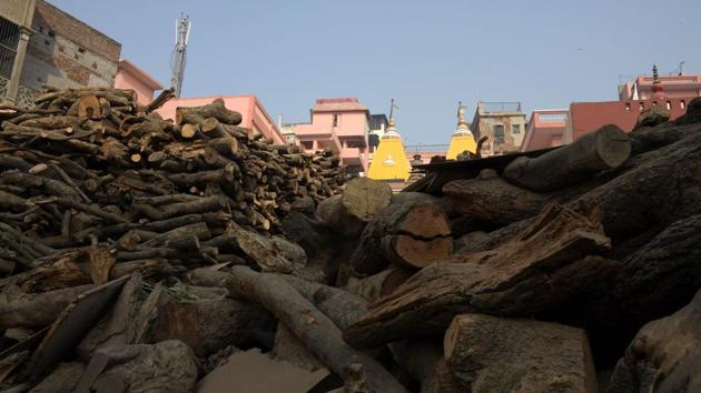 The wood stock at the traditional crematorium grounds at Manikarnika Ghat. Each pyre needs between 200 and 400 kilogrammes, meaning the sacred city in northern India burns through as much as 80 tonnes every day. (Dominique Faget / AFP)