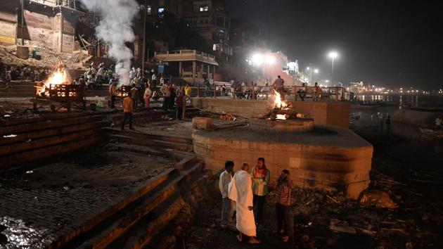 Bodies being cremated at Harischandra Ghat. Electric crematoriums introduced in 1989 as part of the “Clean Ganga” action plan have not found many takers in spite of the lower cost -- around $6 compared to $60-70 -- and being less polluting. On average only five to seven bodies are cremated every day in the electric crematoriums. (Dominique Faget / AFP)