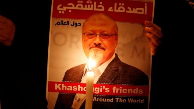 A demonstrator holds a poster with a picture of Saudi journalist Jamal Khashoggi outside the Saudi Arabia consulate in Istanbul, Turkey.(Reuters)