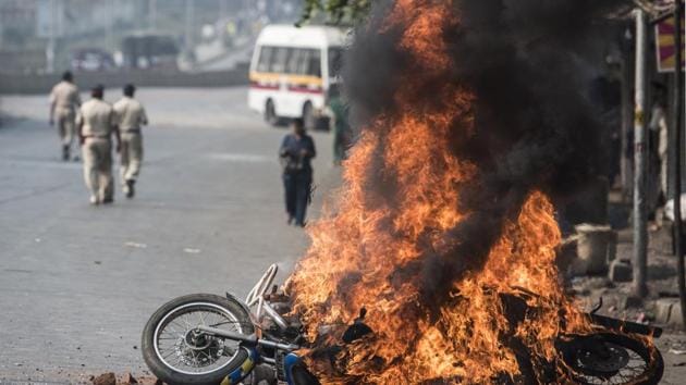 A bike is burnt in Mumbai in January 2018 after the Bhima-Koregaon violence. (HT FILE) A bike is burnt in Mumbai in January 2018 after the Bhima-Koregaon violence. (HT FILE)