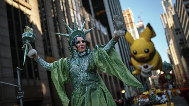 Performers and balloons move through Sixth Avenue during the 92nd Macy’s Thanksgiving Day Parade in New York. (Andres Kudacki / AP) Performers and balloons move through Sixth Avenue during the 92nd Macy’s Thanksgiving Day Parade in New York. (Andres Kudacki / AP)