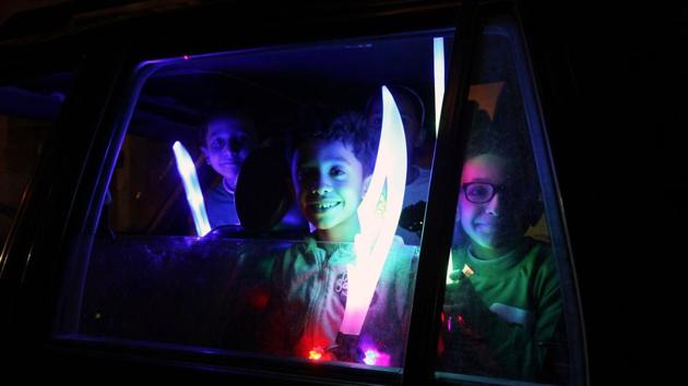 Libyan youth gather in a neighbourhood in the city of Benghazi on the occasion of the Prophet Mohammed’s birthday. (Abdullah Doma / AFP) Libyan youth gather in a neighbourhood in the city of Benghazi on the occasion of the Prophet Mohammed’s birthday. (Abdullah Doma / AFP)