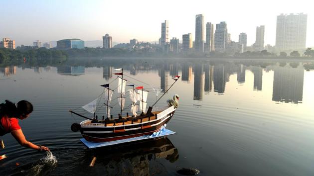 A woman helps a paper boat set sail in Navi Mumbai, Maharashtra on the occasion of Boita Bandana. The festival is an age old celebration of Odisha’s maritime culture, marked traditionally by the wives of traders heading out to South East Asia by consecrating symbolic boats, praying for safe passage, on November 23, 2018. (Bachchan Kumar / HT Photo) A woman helps a paper boat set sail in Navi Mumbai, Maharashtra on the occasion of Boita Bandana. The festival is an age old celebration of Odisha’s maritime culture, marked traditionally by the wives of traders heading out to South East Asia by consecrating symbolic boats, praying for safe passage, on November 23, 2018. (Bachchan Kumar / HT Photo)