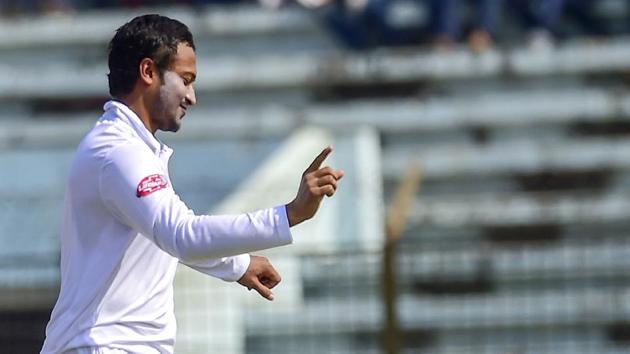 Bangladesh cricket captain Shakib Al Hasan celebrates after the dismissal of the West Indies cricketer Shai Hope.(AFP/Getty Images)