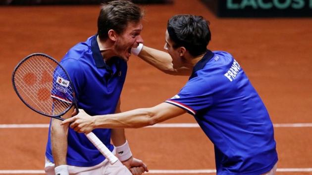 France's Pierre-Hugues Herbert and Nicolas Mahut celebrate winning their doubles match against Croatia.(REUTERS)