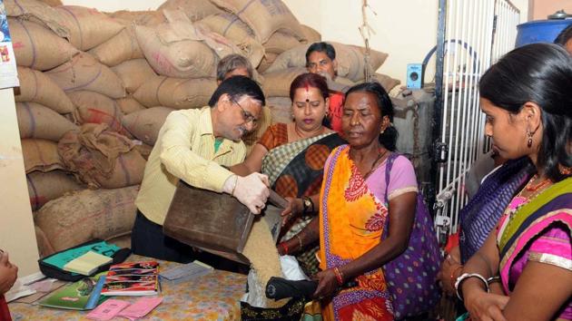 Public purchasing food grain distributed through PDS shop by the new ration card issued by the state government in Ranchi(HT File Photo)