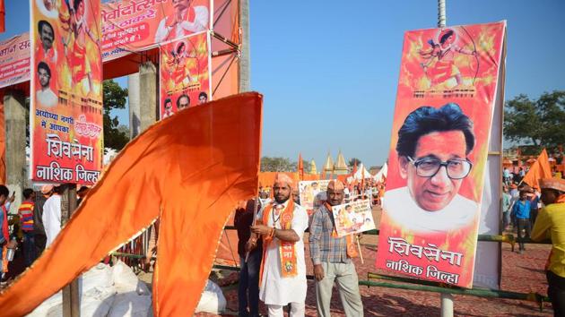 Shiv Sena activists wave a flag at Lakshman Qila during an event for the construction of Ram temple in Ayodhya on November 24. (AFP Photo) Shiv Sena activists wave a flag at Lakshman Qila during an event for the construction of Ram temple in Ayodhya on November 24. (AFP Photo)