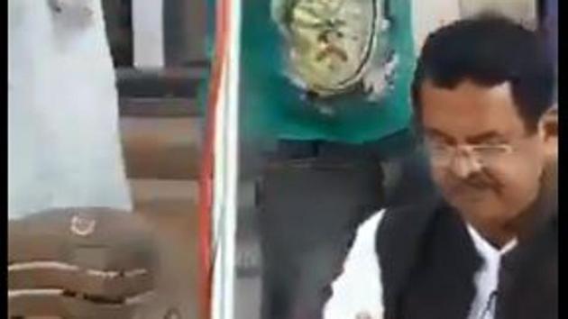 Screengrab of video showing former Odisha BJP legislator attacked by man on stage.(Debabrata Mohanty/Twitter)