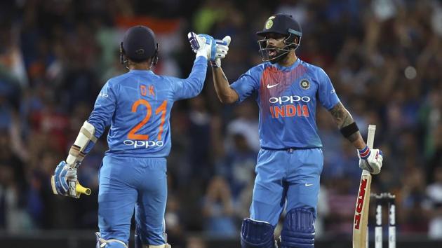 India's Virhat Kohli right, celebrates with teammate Dinesh Karthik during their Twenty20 cricket match against Australia in Sydney, Sunday, Nov. 25, 2018. (AP Photo/Rick Rycroft)(AP)