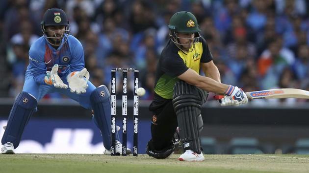 Australia's Aaron Finch plays a sweep shot as India's Rishabh Pant watches during their Twenty20 cricket match in Sydney, Sunday, Nov. 25, 2018. (AP Photo/Rick Rycroft) (AP) Australia's Aaron Finch plays a sweep shot as India's Rishabh Pant watches during their Twenty20 cricket match in Sydney, Sunday, Nov. 25, 2018. (AP Photo/Rick Rycroft) (AP)