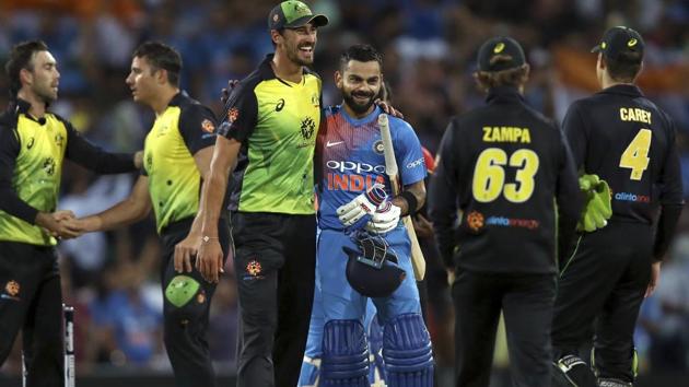 India's Virat Kohli is embraced by Australia's Mitchell Starc after their Twenty20 cricket match in Sydney. (AP)