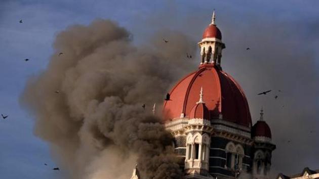 Smoke billowing out from below the main dome of the Taj Hotel in Mumbai.(HT File Photo)