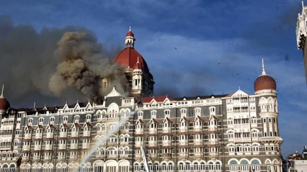 26/11 - Mumbai Under Terror Attack - Firing - Fire at Taj Hotel - Fire brigade officers fighting with fire at Taj hotel.(HT Photo)