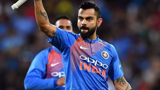 Virat Kohli celebrates his team's victory against Australia in a T20 international cricket match at the SCG in Sydney.(AFP)