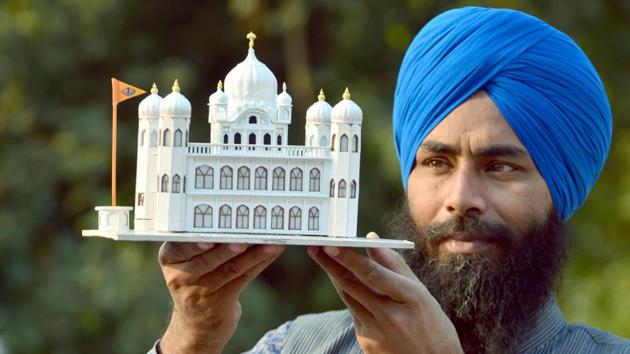 Paper artist Gurpreet Singh shows his art work in the form of a model of Gurdwara Kartarpur Sahib in Amritsar. (Sameer Sehgal/Hindustan Times) Paper artist Gurpreet Singh shows his art work in the form of a model of Gurdwara Kartarpur Sahib in Amritsar. (Sameer Sehgal/Hindustan Times)