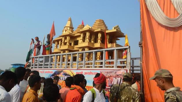 People watch a model of the Ram temple during the 'Dharam Sabha' Hindu congregation held to call for the construction of a grand temple of Lord Rama, in Ayodhya on November 25. (AFP Photo) People watch a model of the Ram temple during the 'Dharam Sabha' Hindu congregation held to call for the construction of a grand temple of Lord Rama, in Ayodhya on November 25. (AFP Photo)