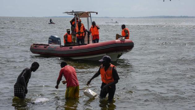 Rescuers search for victims at the site of a capsized cruise boat on Lake Victoria near Mutima village, south of Kampala, Uganda, on November 25, 2018. (AFP Photo) Rescuers search for victims at the site of a capsized cruise boat on Lake Victoria near Mutima village, south of Kampala, Uganda, on November 25, 2018. (AFP Photo)