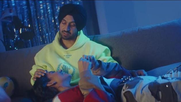 Diljit Dosanjh and Banita Sandhu in a still from his video Jind Mahi.