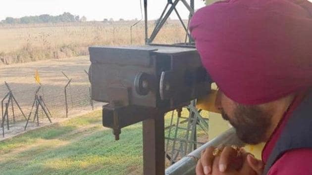 Punjab cabinet minister Navjot Singh Sidhu on Monday morning paid obeisance to Gurdwara Kartarpur Sahib in Pakistan from the Indian side of the international border.(ANI Photo/Twitter)