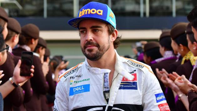 McLaren's Spanish driver Fernando Alonso walks ahead of the Abu Dhabi Formula One Grand Prix.(AFP)