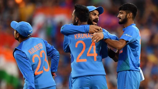 India's captain Virat Kohli (C) celebrates the dismissal of Australia's Alex Carey off India's spin bowler Krunal Pandya (#24) during a T20 international cricket match at the SCG in Sydney on November 25, 2018.(AFP)