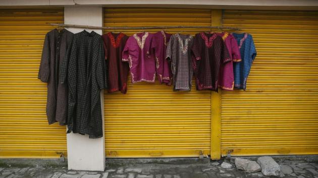 Woolen robes are displayed for sale outside a closed shop by a pavement vendor during a strike in Srinagar on Monday. Normal life was disrupted in Kashmir on Monday due to a strike called by separatists to protest the recent killings in the valley. (Mukhtar Khan / AP) Woolen robes are displayed for sale outside a closed shop by a pavement vendor during a strike in Srinagar on Monday. Normal life was disrupted in Kashmir on Monday due to a strike called by separatists to protest the recent killings in the valley. (Mukhtar Khan / AP)