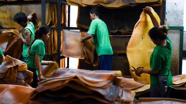 Workers sort out raw rubber sheets. The ruling junta is trying to address supply-side issues and is aiming to reduce the area under cultivation for rubber. At the same time rubber remains an intensely political issue in Thailand. Farmers and tappers -- the majority come from the junta-aligned south -- are notoriously quick to protest when times get tough. (Jonathan Klein / AFP) 