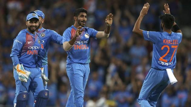 India's Jasprit Bumrah, centre, is congratulated by teammates after running out Australia's Chris Lynn during their Twenty20 cricket match in Sydney.(AP)