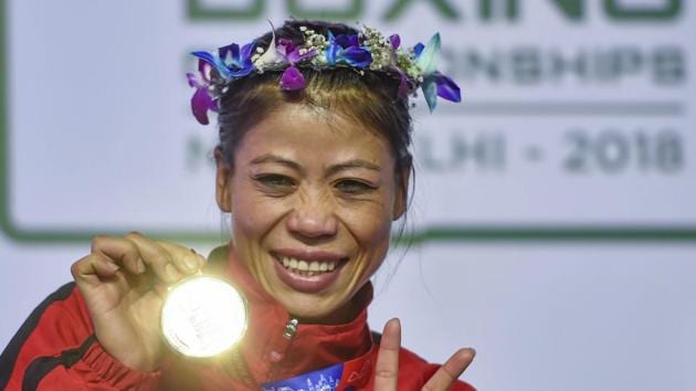 New Delhi: Indian boxer Mary Kom poses with her gold medal after winning the final match of women's light flyweight 45-48 kg against Ukraine's Hanna Okhota at AIBA Women's World Boxing Championships, in New Delhi, Saturday, Nov. 24, 2018(PTI)