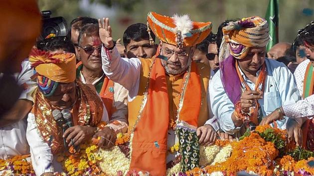 BJP president Amit Shah at a road show in Indore. (PTI) BJP president Amit Shah at a road show in Indore. (PTI)