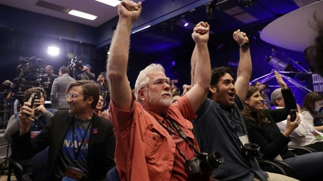 People celebrate as the InSight lander touchdowns on Mars at NASA's Jet Propulsion Laboratory on Monday, Nov. 26, 2018, in Pasadena, Calif. (AP) People celebrate as the InSight lander touchdowns on Mars at NASA's Jet Propulsion Laboratory on Monday, Nov. 26, 2018, in Pasadena, Calif. (AP)